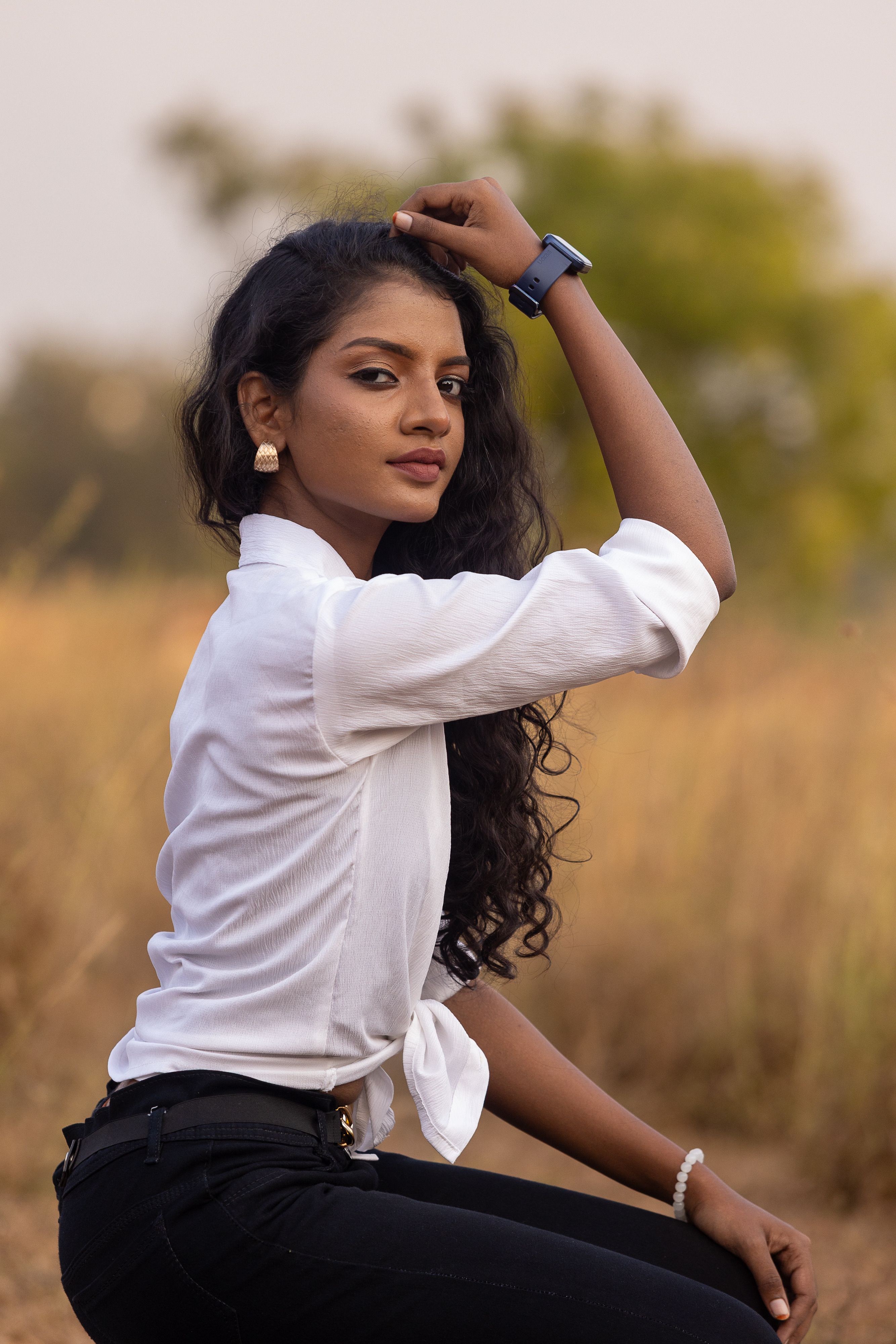 Young Woman Posing Outdoors in Stylish Attire · Free Stock Photo