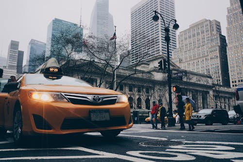 Yellow Toyota Sedan on in Highway Road