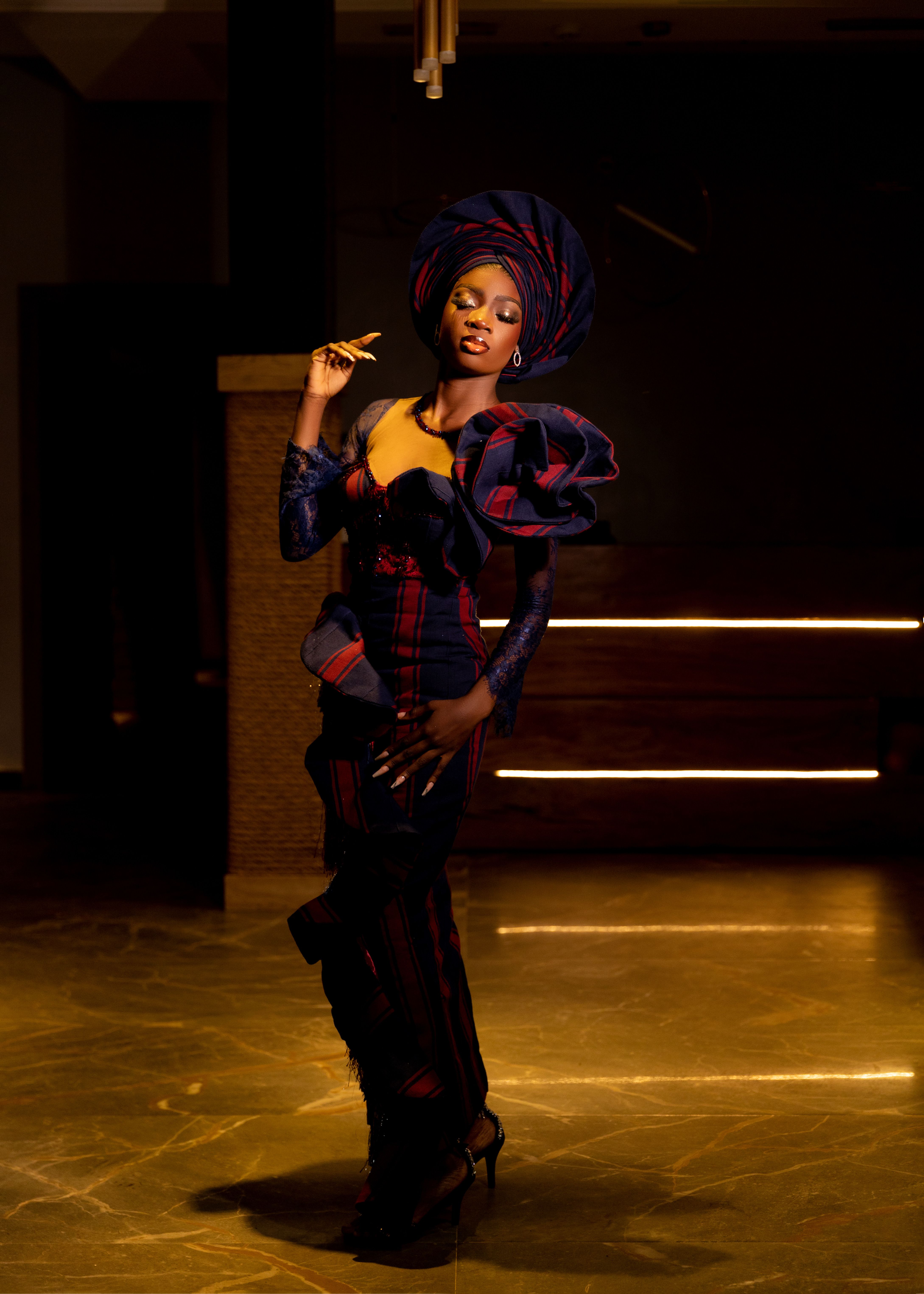 Elegant Woman in Traditional African Attire Indoors · Free Stock Photo