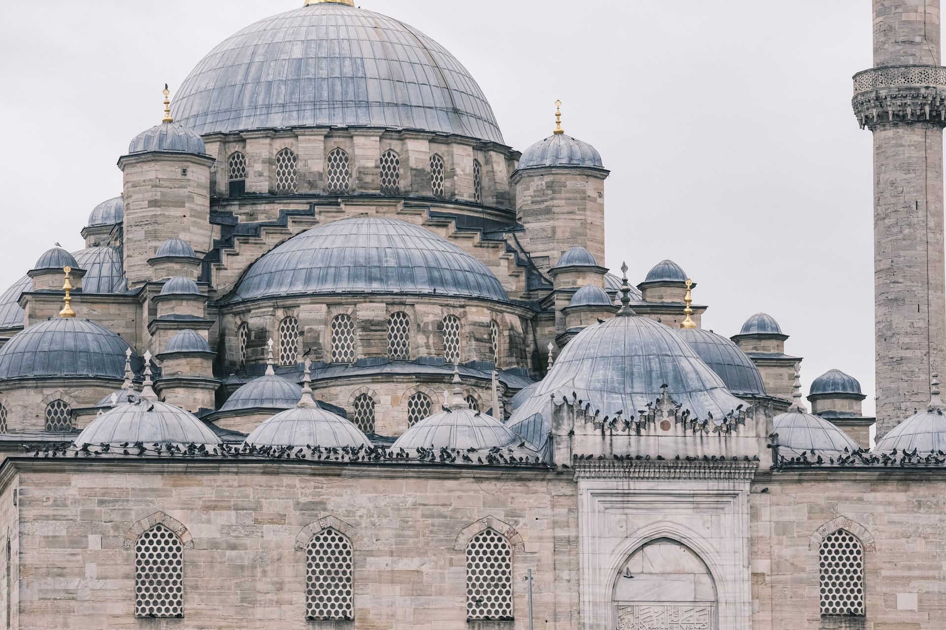Close-up view of ornate dome architecture on a historical mosque, showcasing detailed Islamic design