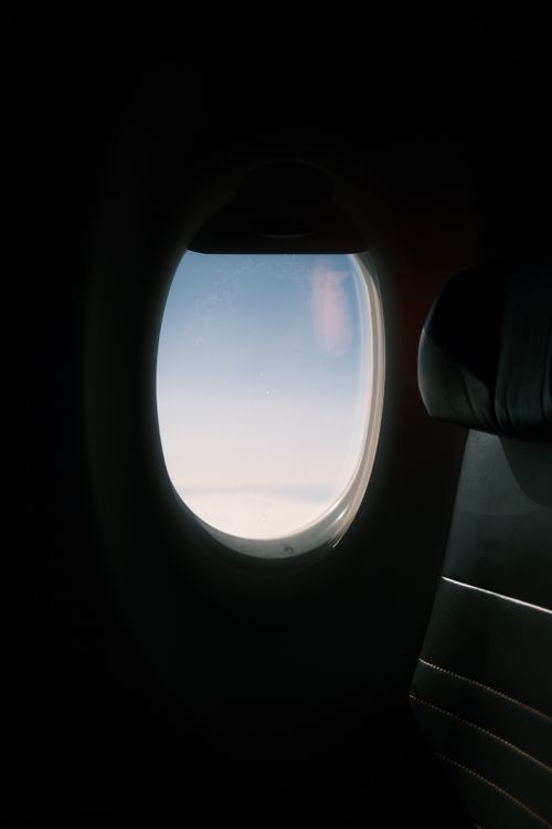 Free Breathtaking view of blue sky from an airplane window seat during flight. Stock Photo