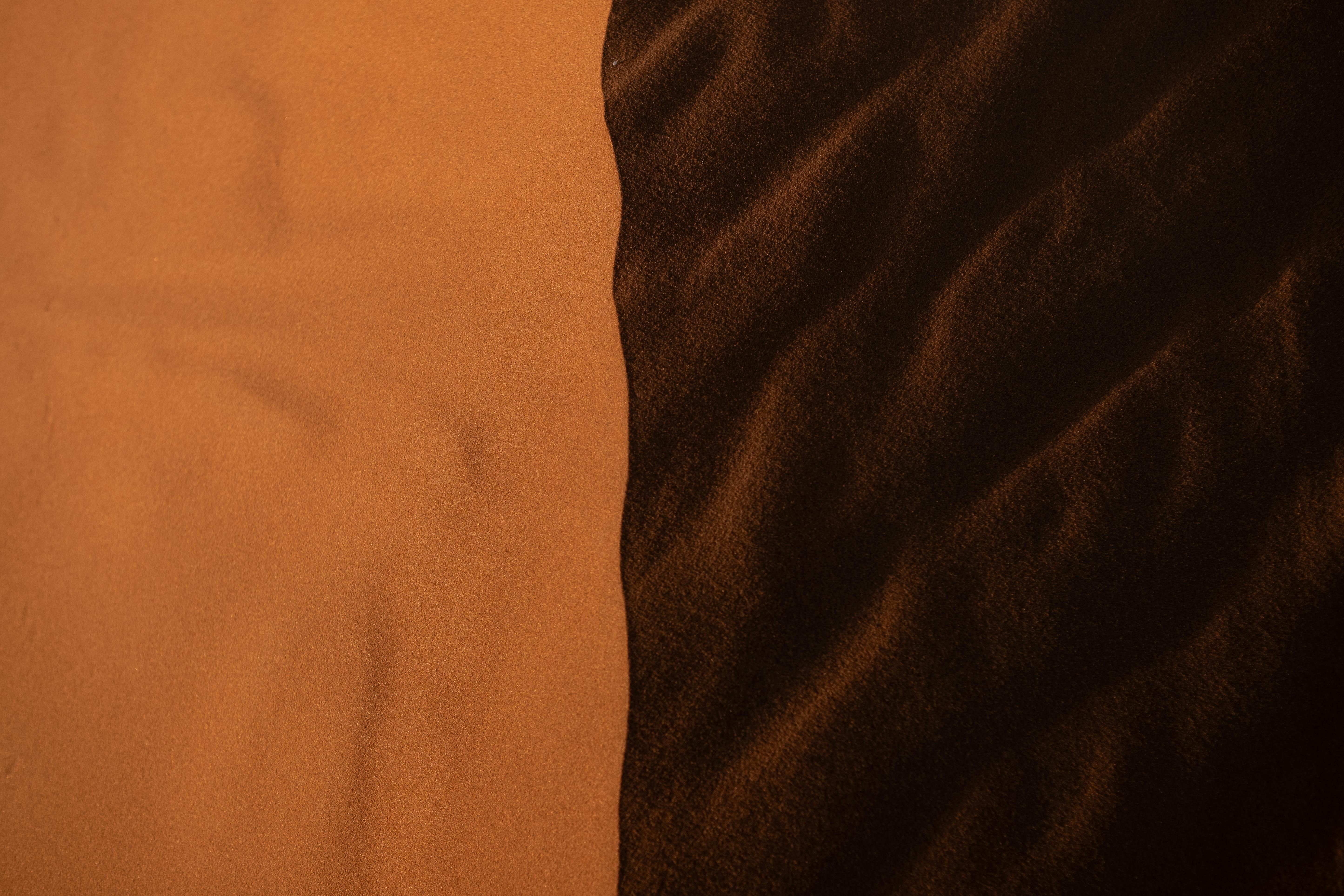 Free Beautiful play of light and shadow across the desert sands in Morocco, showcasing natural textures. Stock Photo