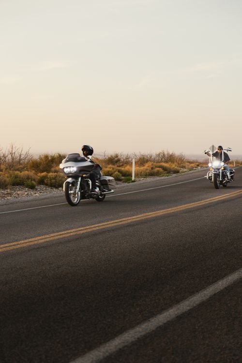 Free Motorcyclists ride through scenic Route 66 in New Mexico during a beautiful sunset. Stock Photo