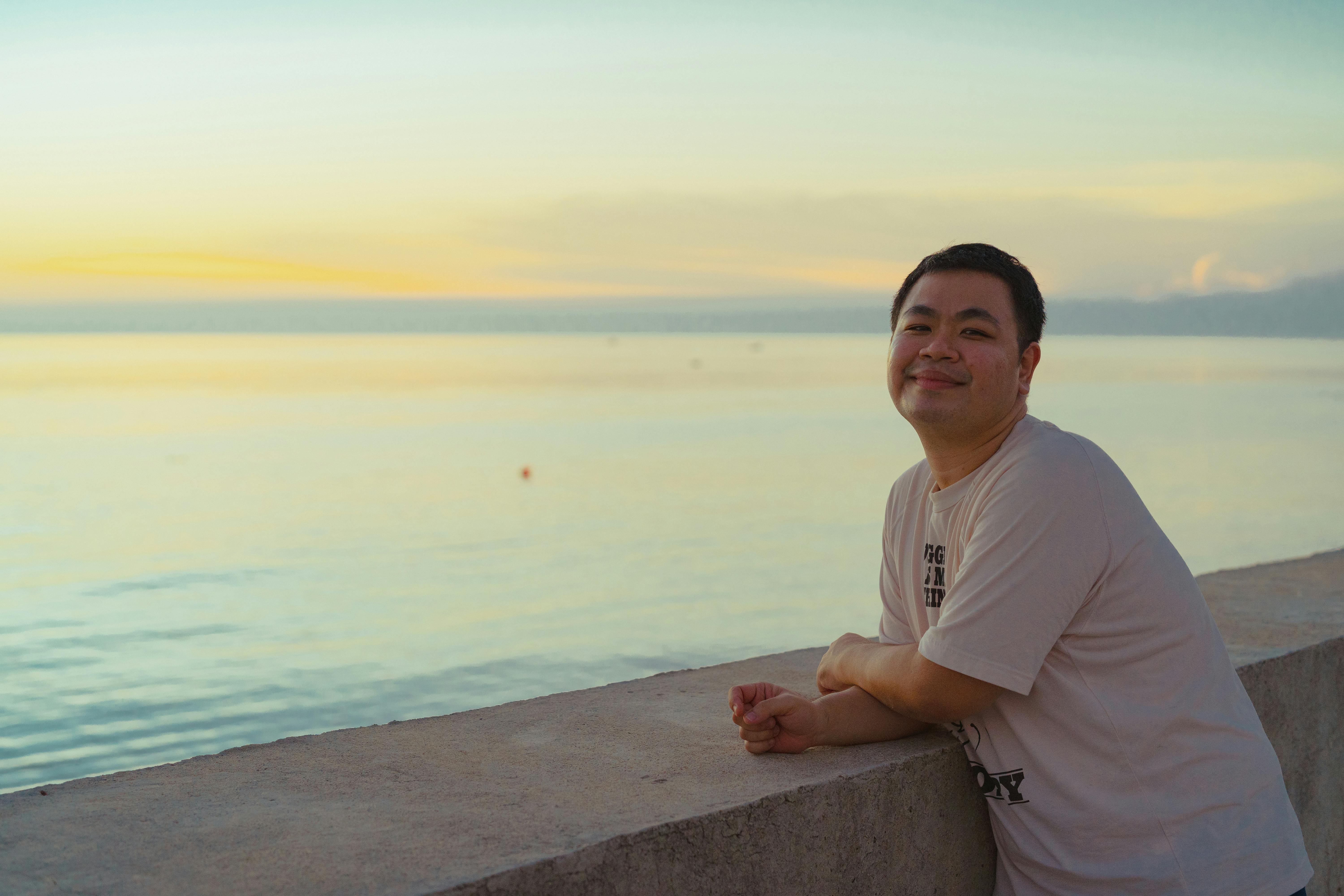 A person enjoying a tranquil sunset on the shoreline in Bình Thuận, Vietnam.