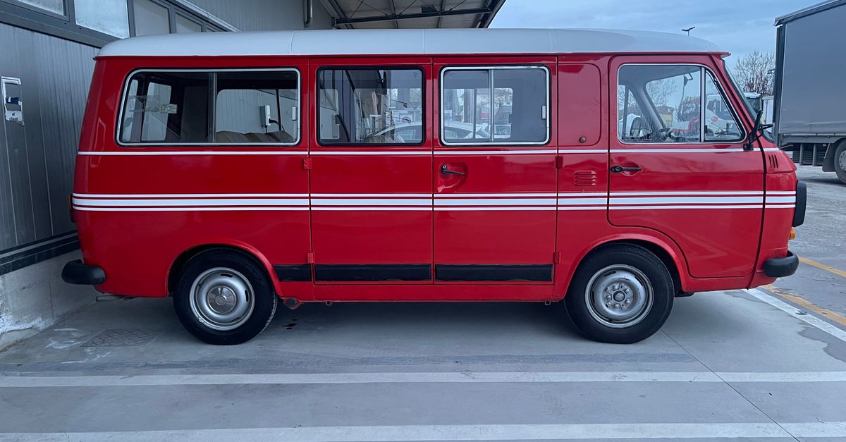 Red Color Mini Van Vintage Red Minivan in Industrial Setting · Free Stock Photo
