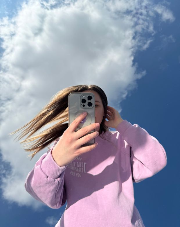 Person taking a selfie outdoors, photo by Lie on Pexels