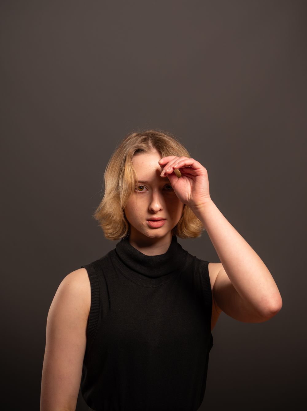 Studio portrait in dramatic light