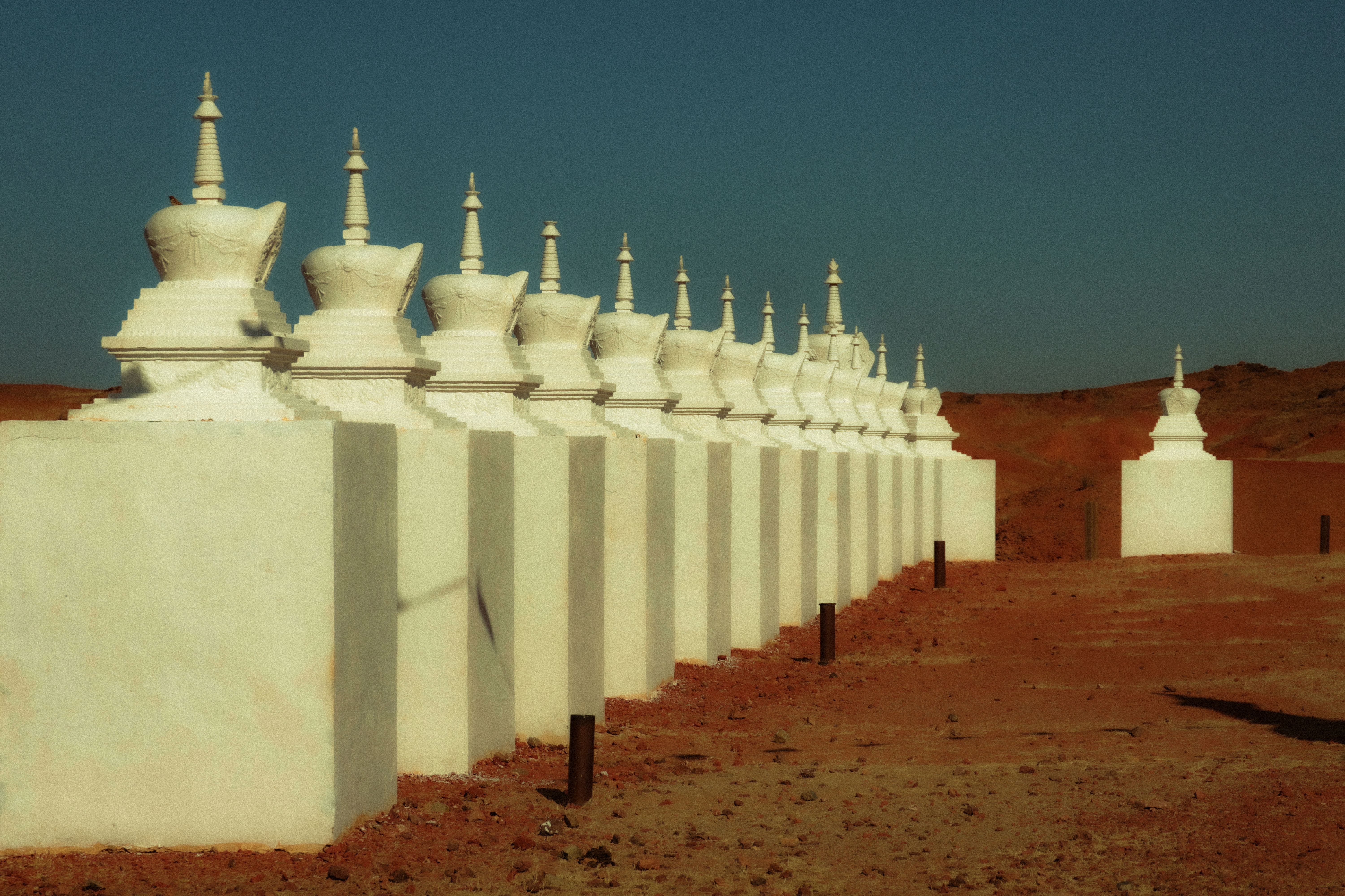 Wusutu Zhao monastery with white stupa and Zhao Dynasty Great Wall in background
