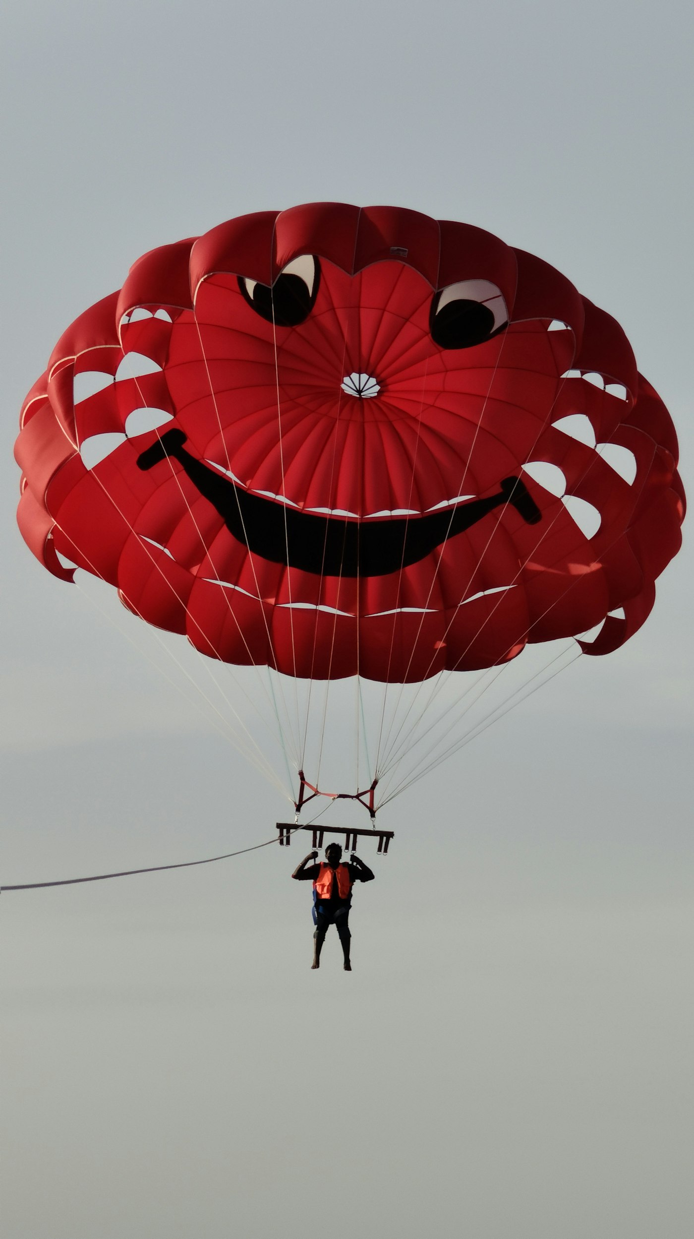 Parasailing over blue water