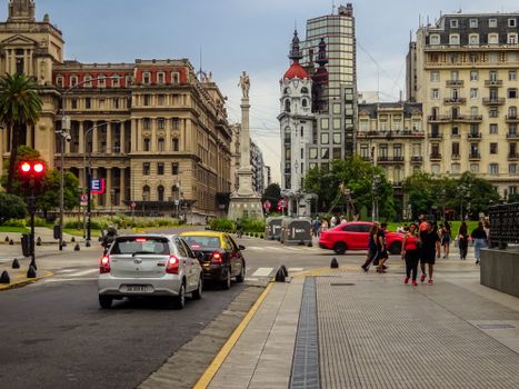 Vibrant cityscape of Buenos Aires featuring historic architecture and daily urban life on a busy street.