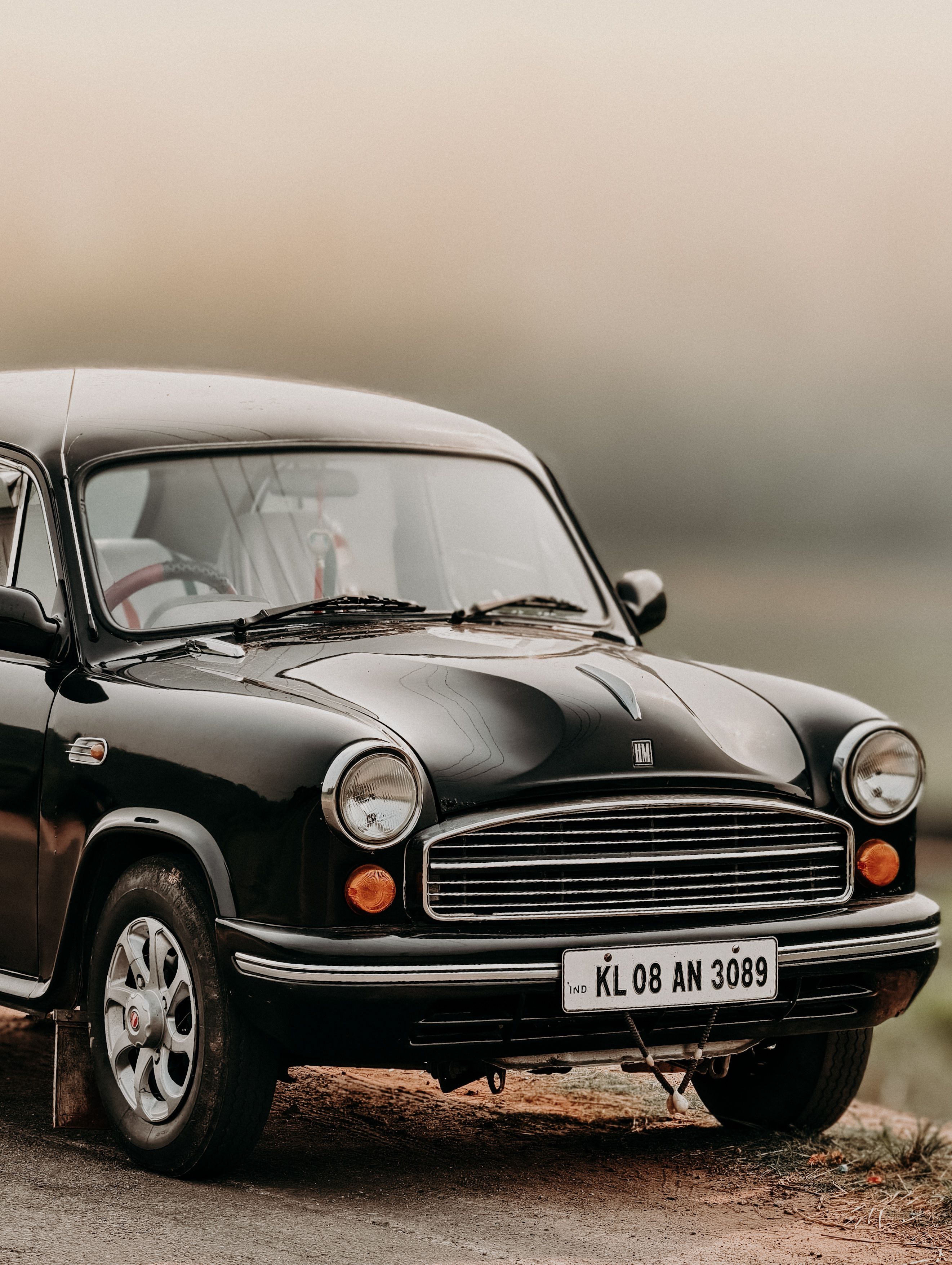 Classic Vintage Car Parked on Rural Road in India · Free Stock Photo