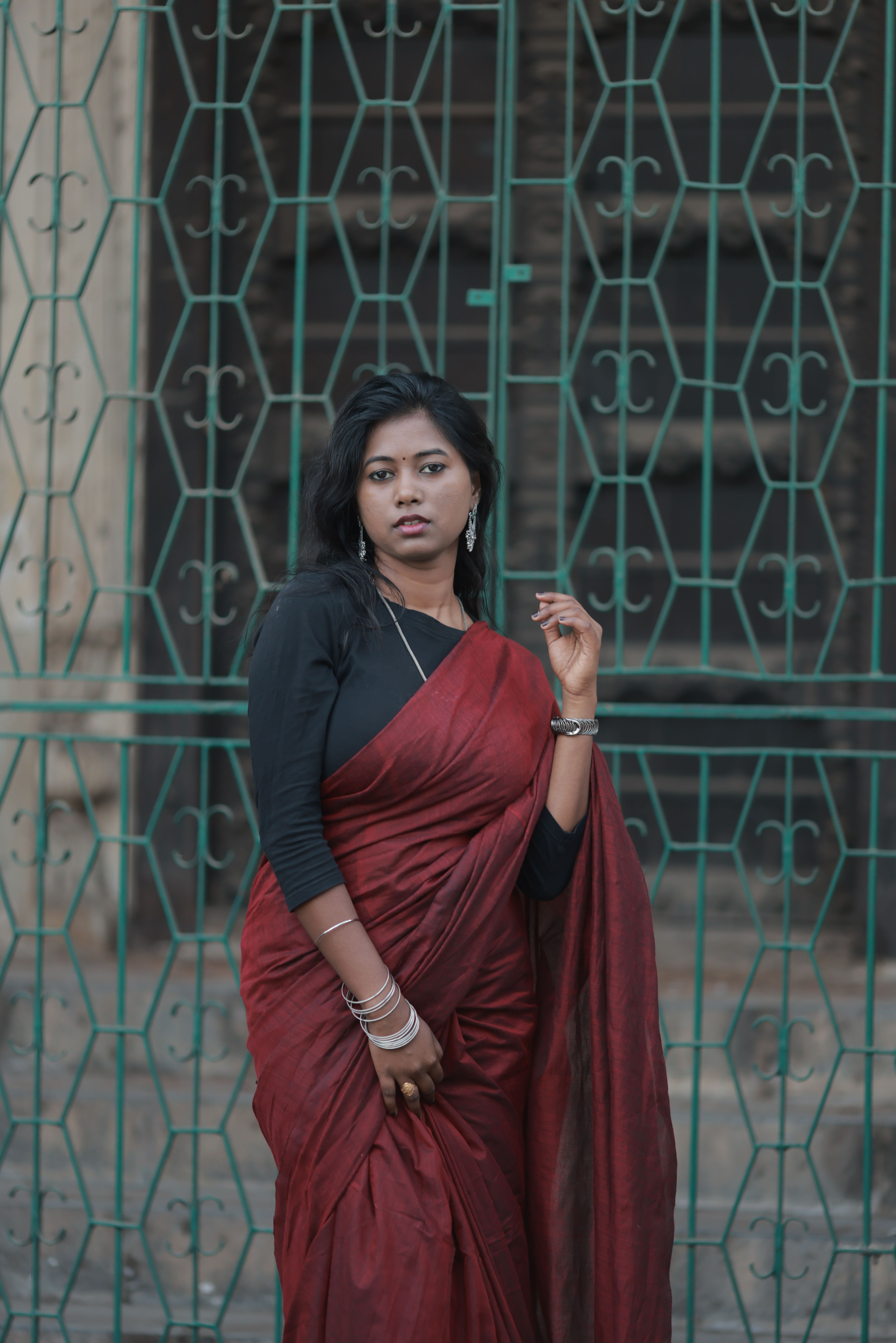 Elegant Woman in Red Sari Posing Outdoors · Free Stock Photo