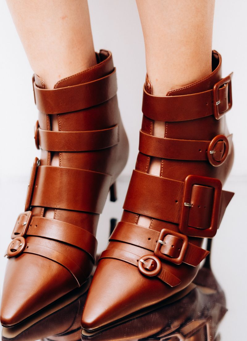 Brown leather ankle boots with buckle detail