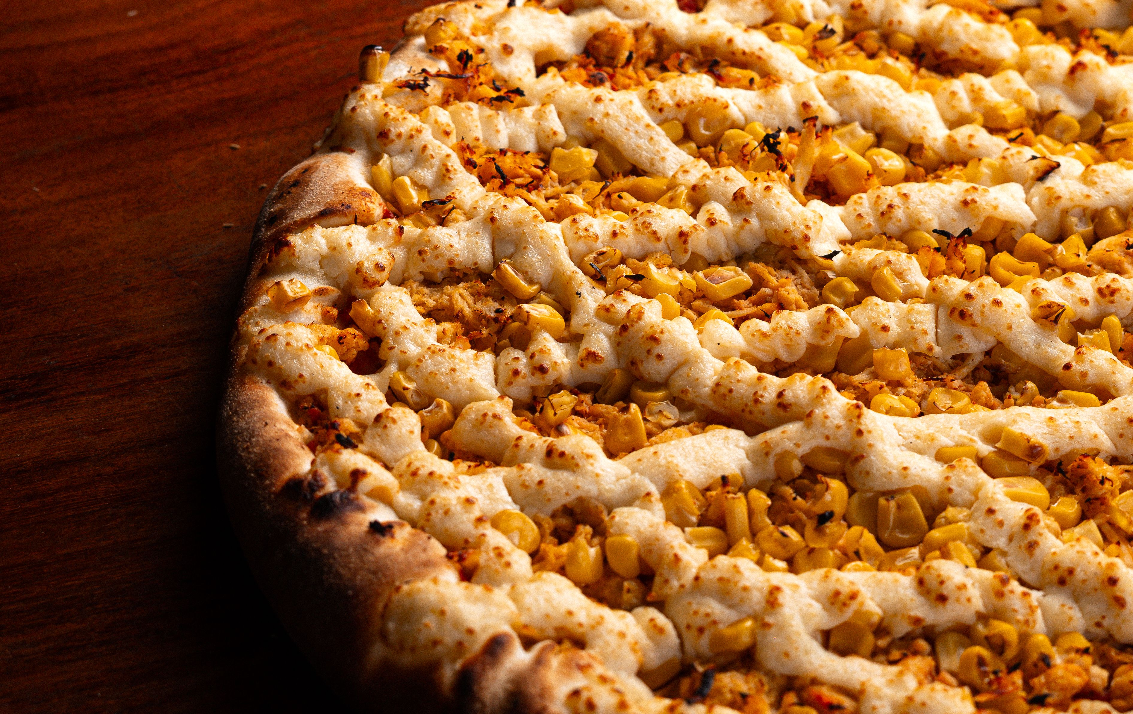 Freshly baked sweet corn and cheese pizza — photo by pedro furtado on Pexels