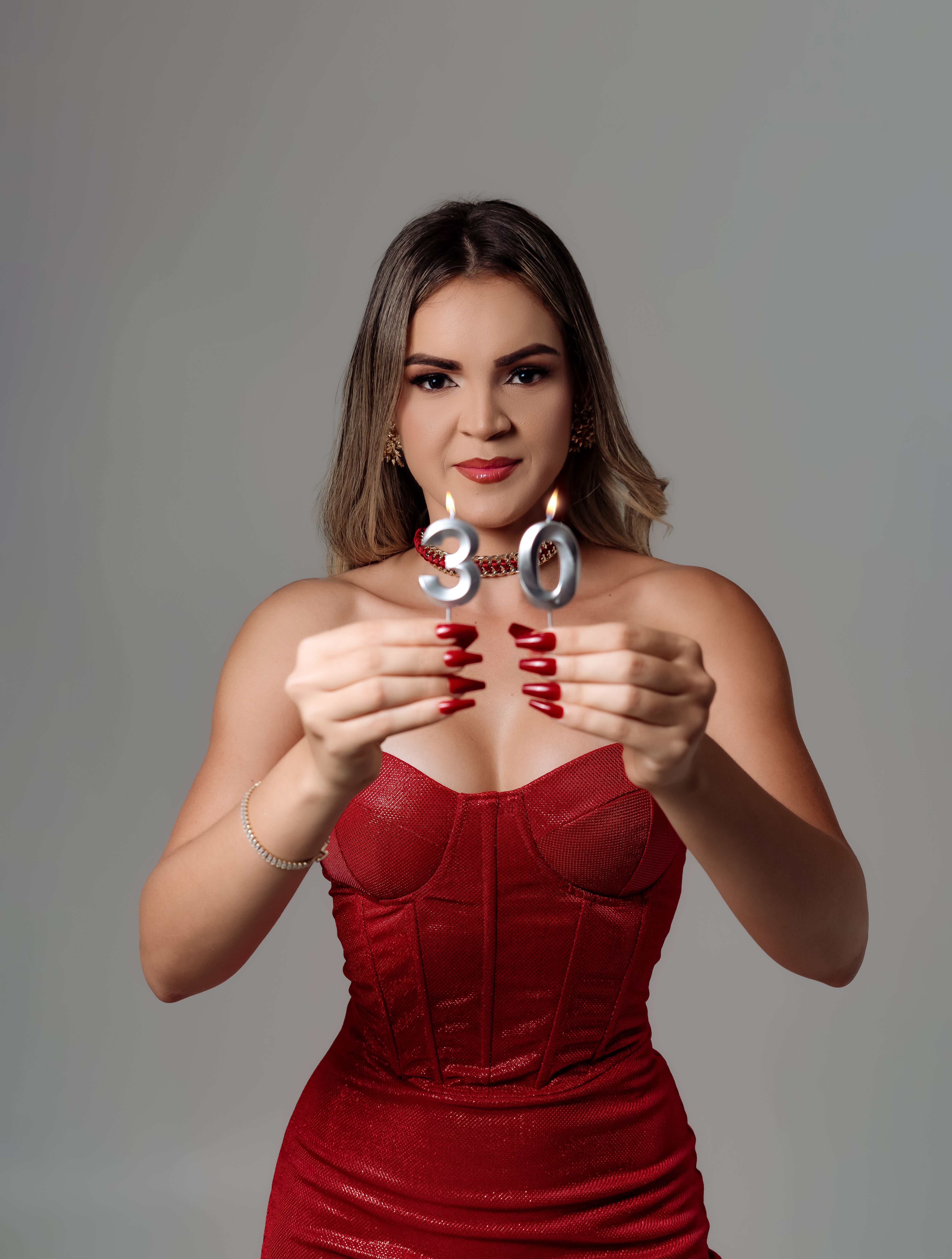 Woman Celebrating 30th Birthday in Red Dress  Free Stock Photo