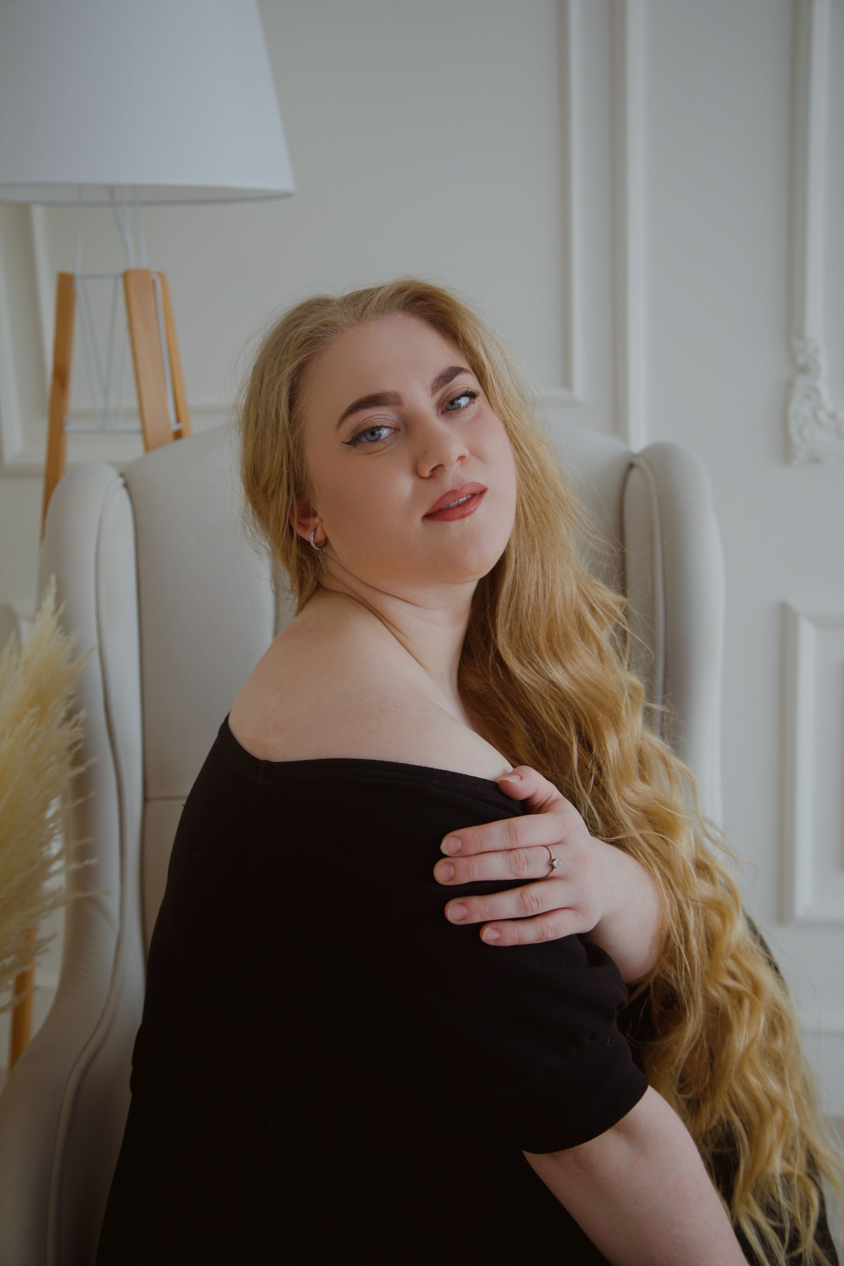 Elegant Woman Posing with Natural Light Indoors · Free Stock Photo