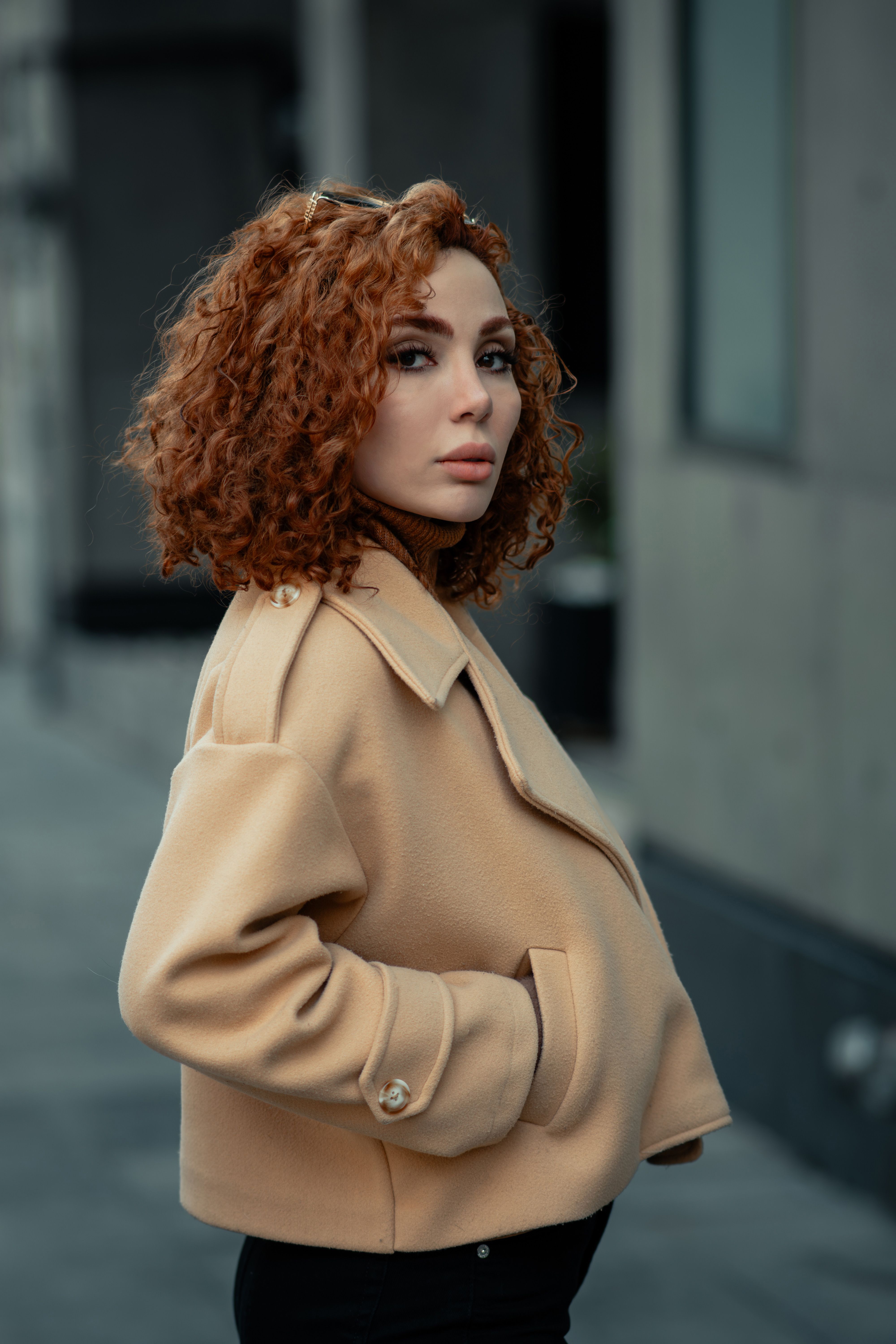 Stylish Woman in Beige Coat on Urban Street · Free Stock Photo