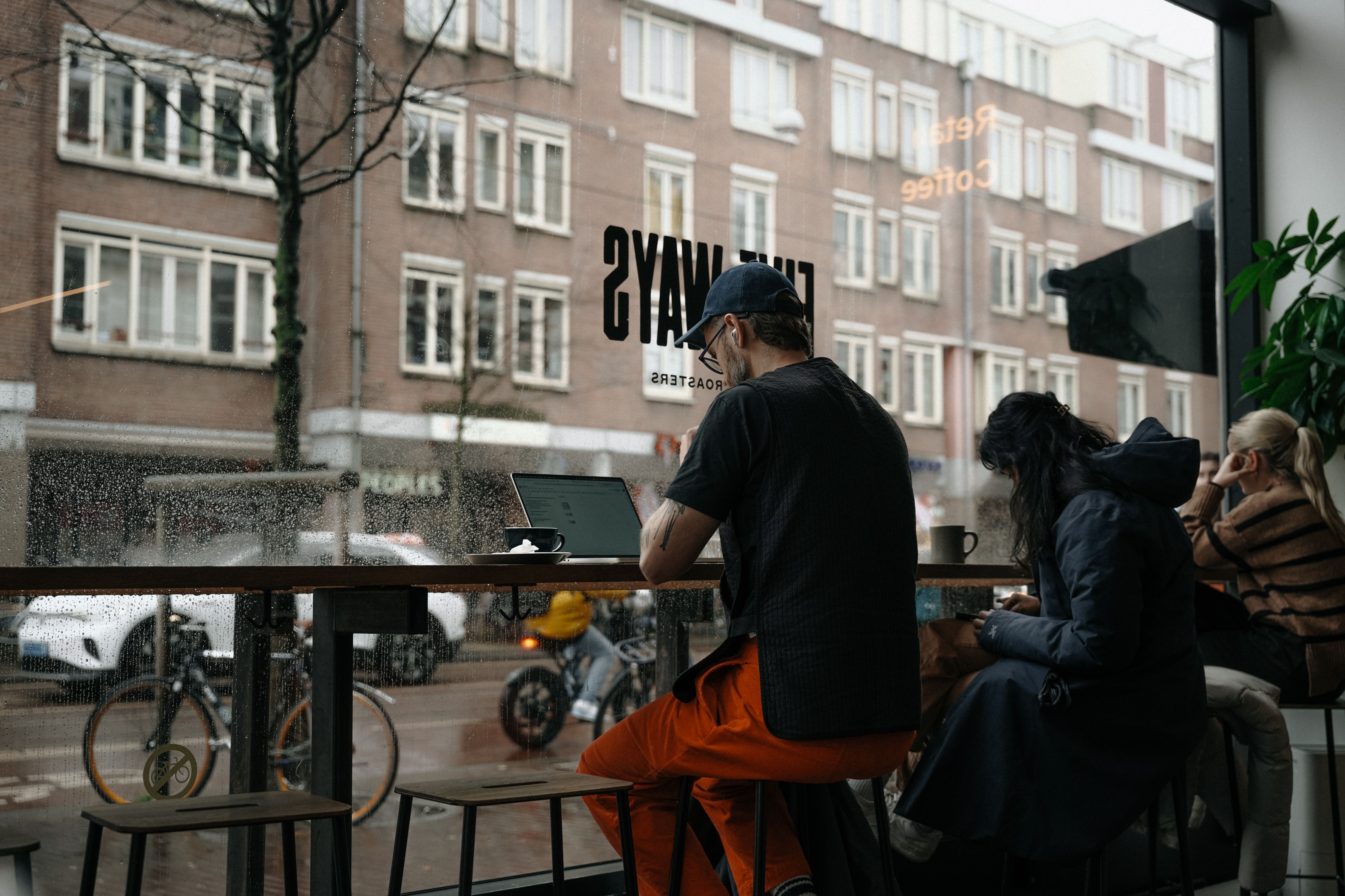 A cozy Dutch café (bruincafé) — the culture of gezelligheid is how the Dutch survive 6 months of gray, wet weather