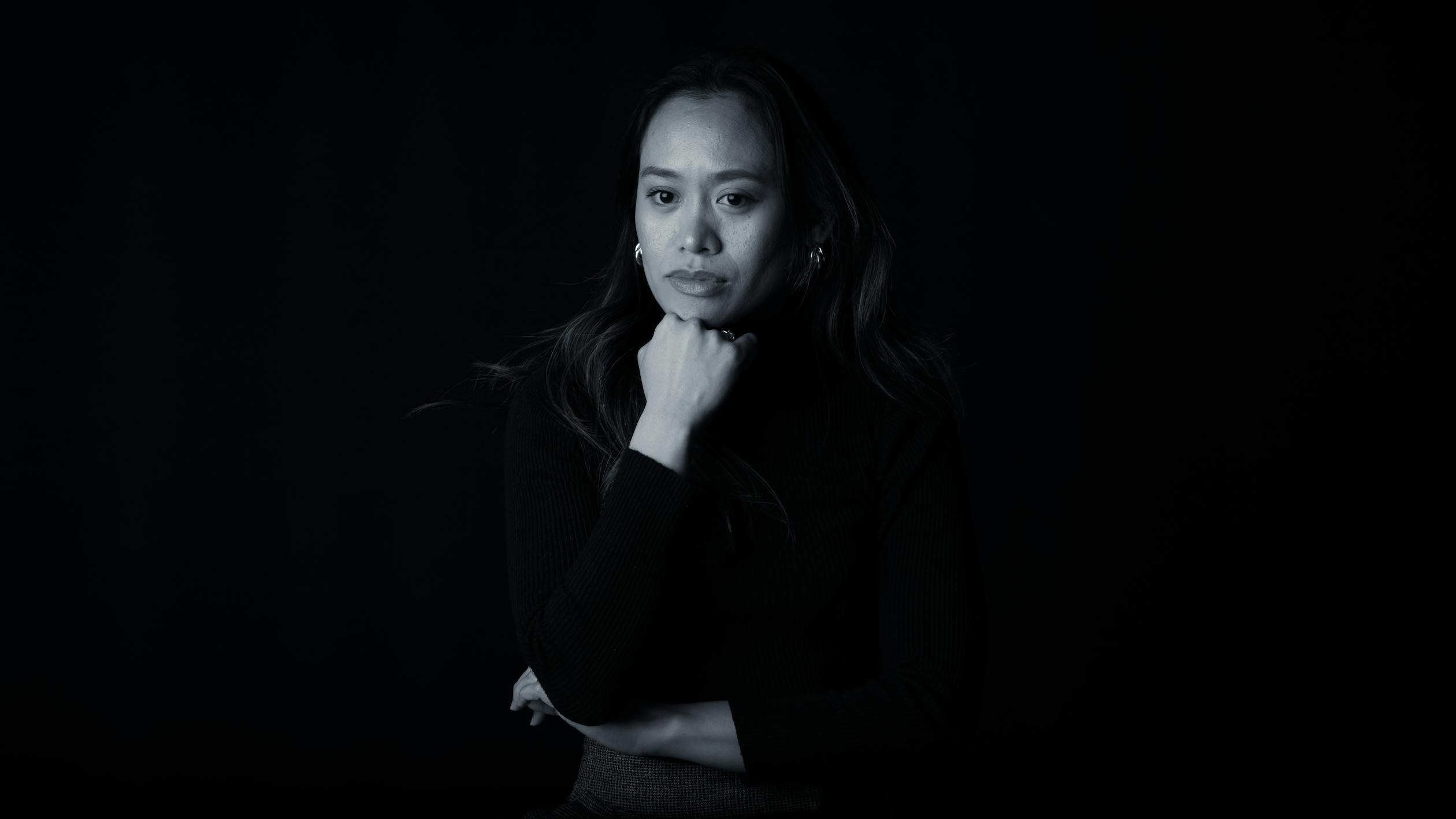 Thoughtful Woman in Black and White Portrait