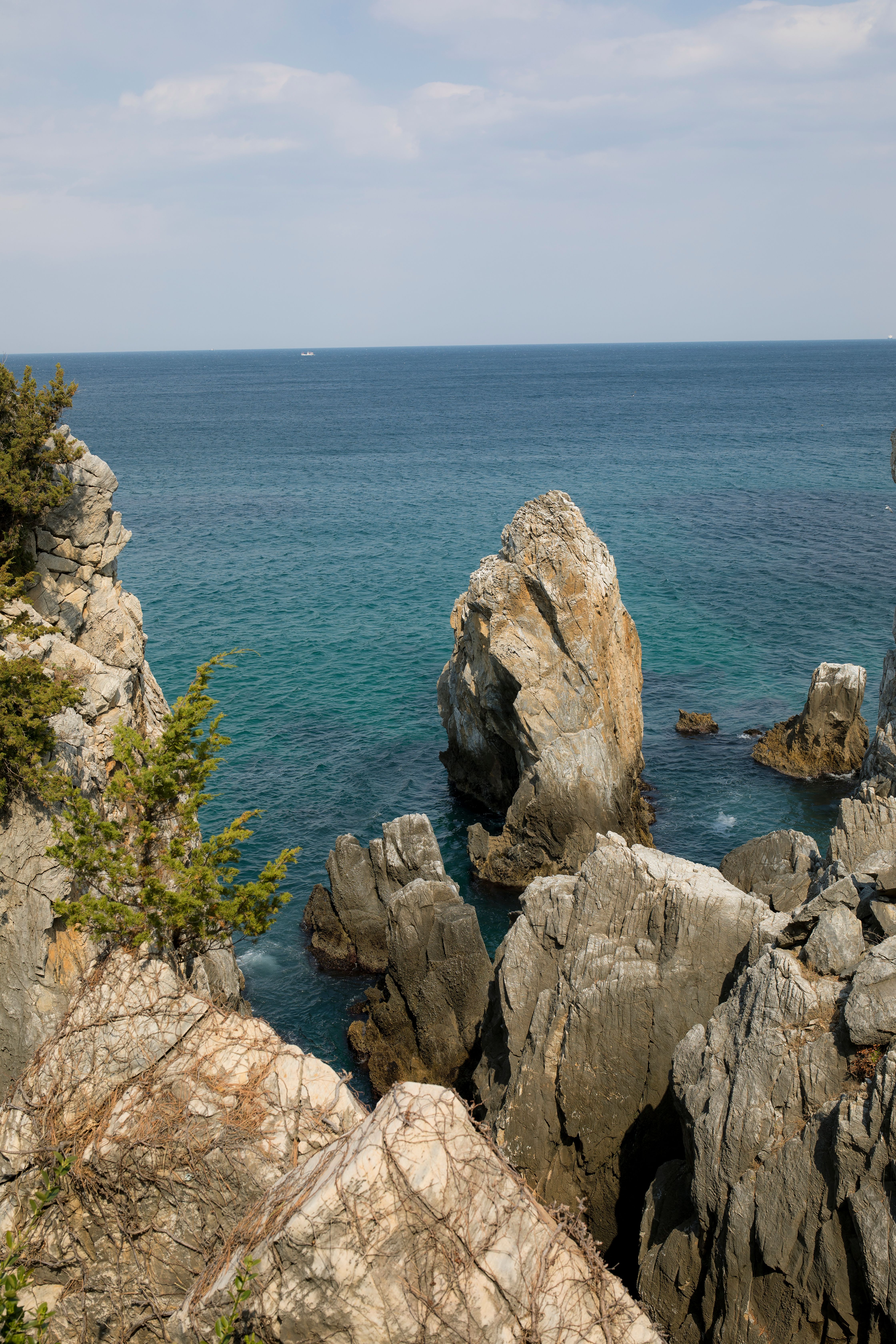 Scenic Coastal Rocks and Clear Blue Sea View · Free Stock Photo