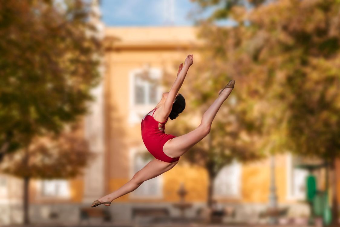Middle Split Dancer Open Energetic Female Dancer in Mid-Air Split · Free Stock Photo