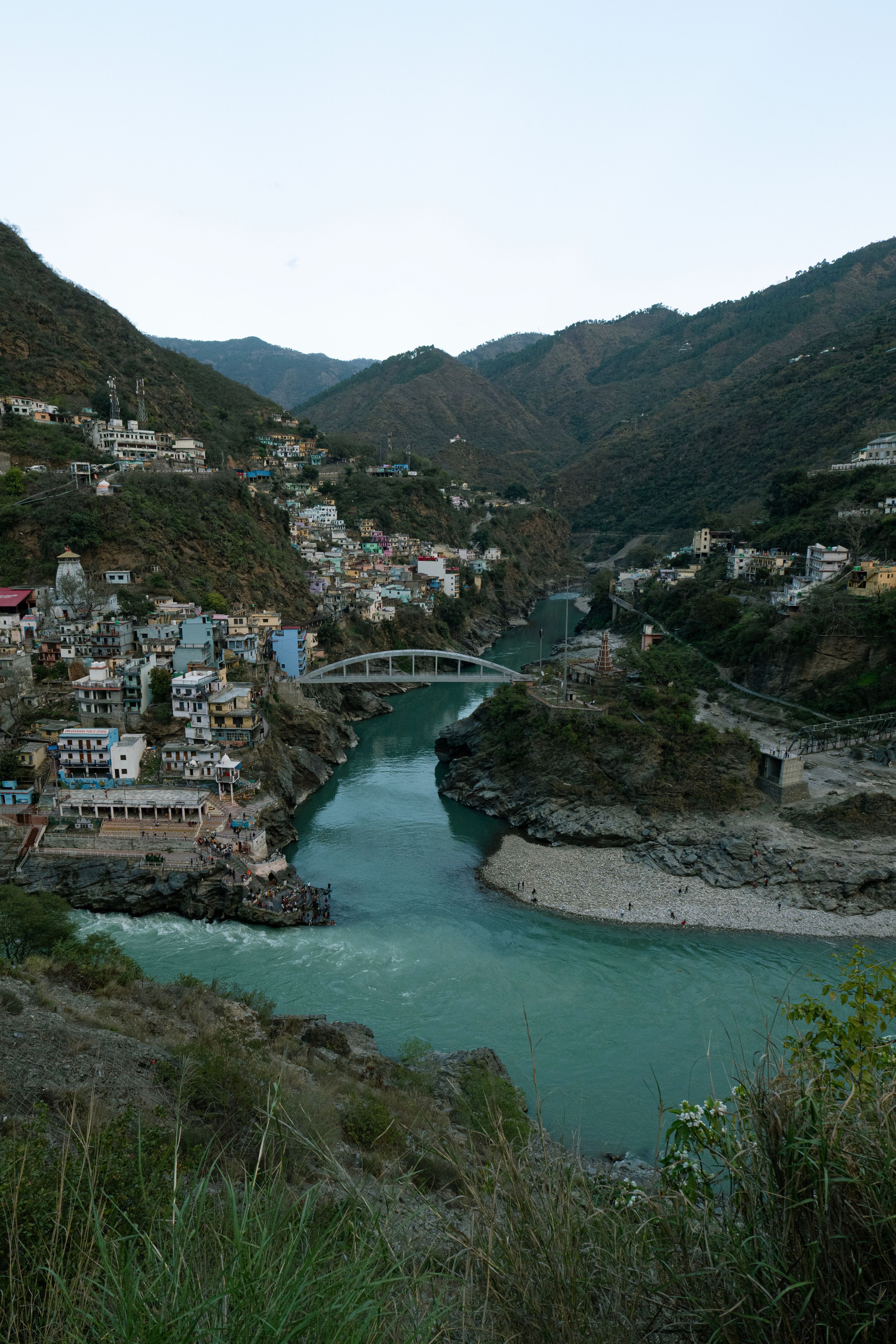 A breathtaking view of Devprayag where the Alaknanda and Bhagirathi rivers meet in Uttarakhand, India.