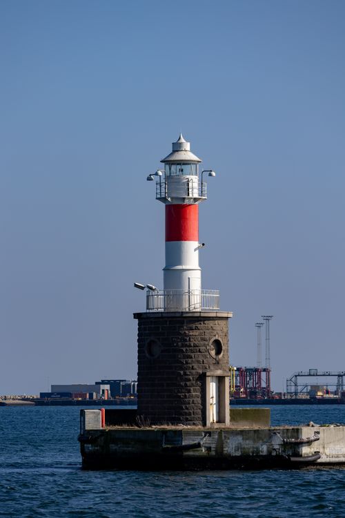 Free A serene view of Aarhus lighthouse on a clear day in Denmark. Stock Photo