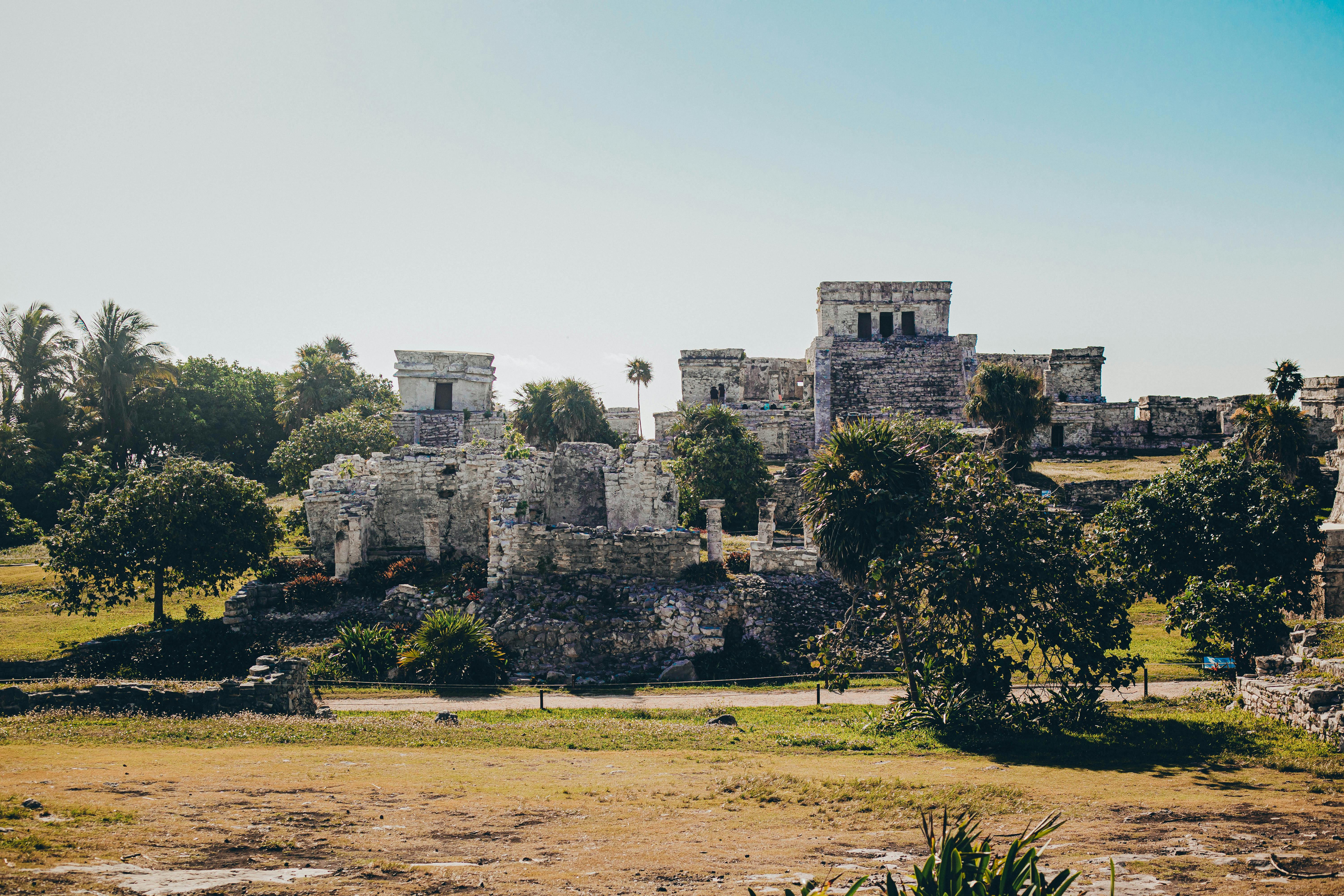 best time of year to visit mayan ruins mexico - Explore the stunning Mayan ruins of Tulum against a clear blue sky.