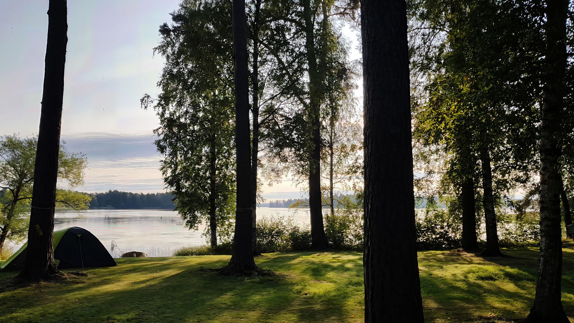 https://www.pexels.com/photo/serene-forest-camp-by-a-lakeside-at-sunset-31458423/