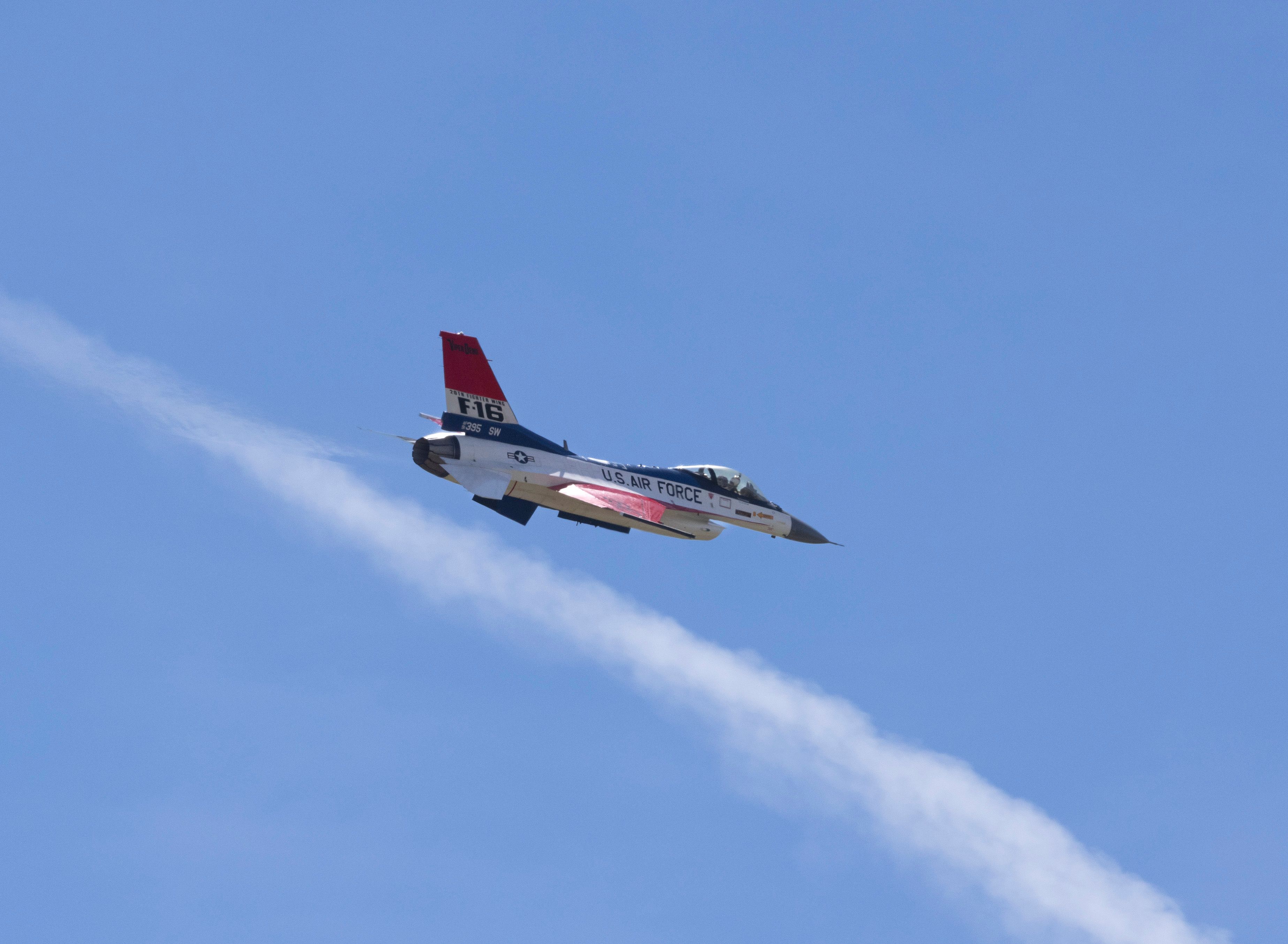 US Air Force F-16 Fighter Jet in Blue Sky · Free Stock Photo