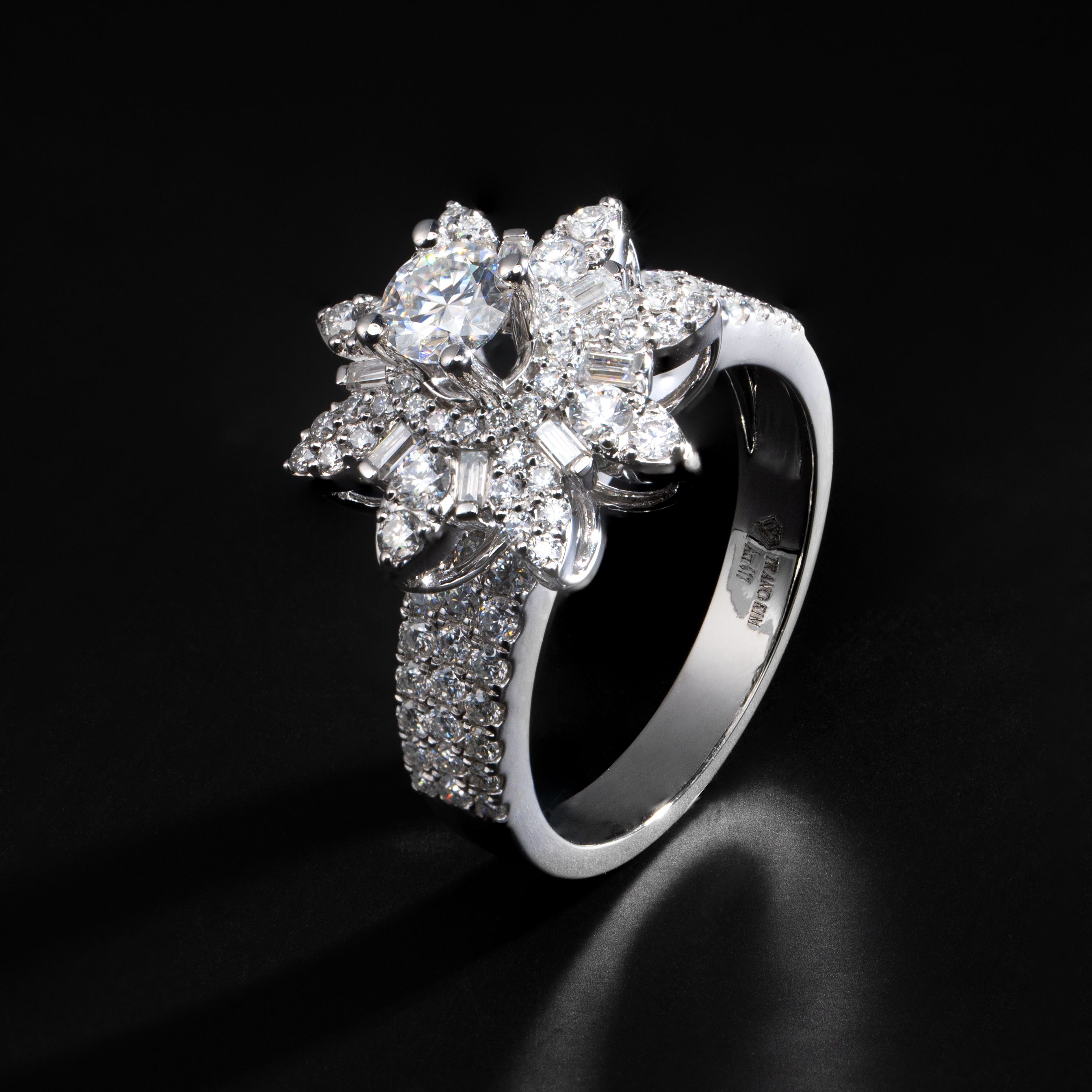 Close-up of a luxurious diamond ring with intricate design on a black surface.