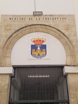 Historic Mercado de la Concepción entrance in El Puerto de Santa María, showcasing architectural heritage.