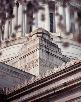 Detailed view of neoclassical architectural details on a historic building facade.