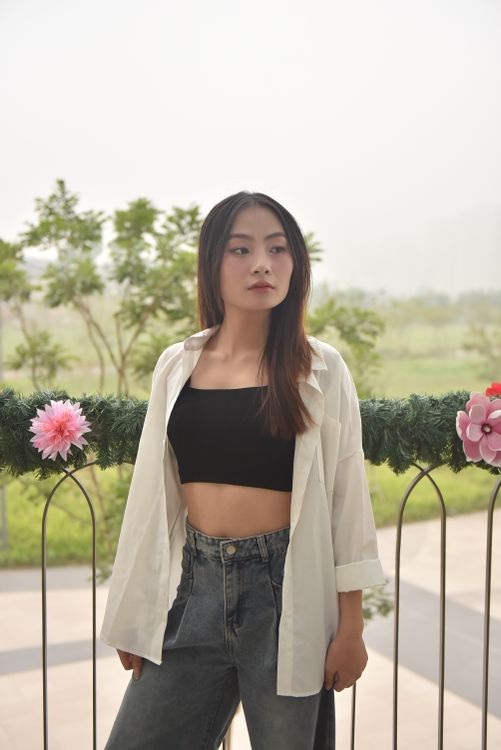 Young Woman Posing Outdoors in Casual Fashion · Free Stock Photo