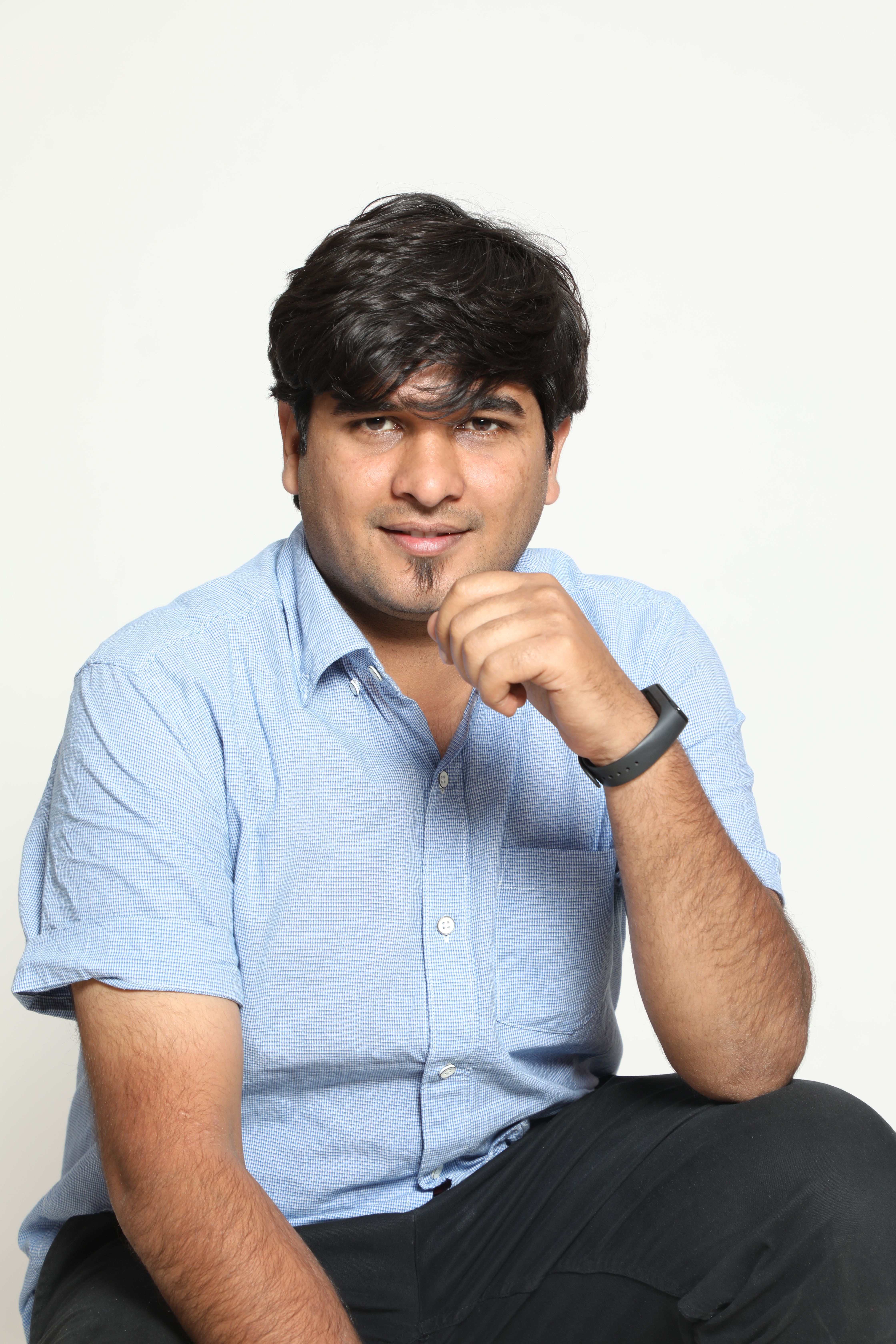 Confident Young Man in Blue Shirt Portrait · Free Stock Photo