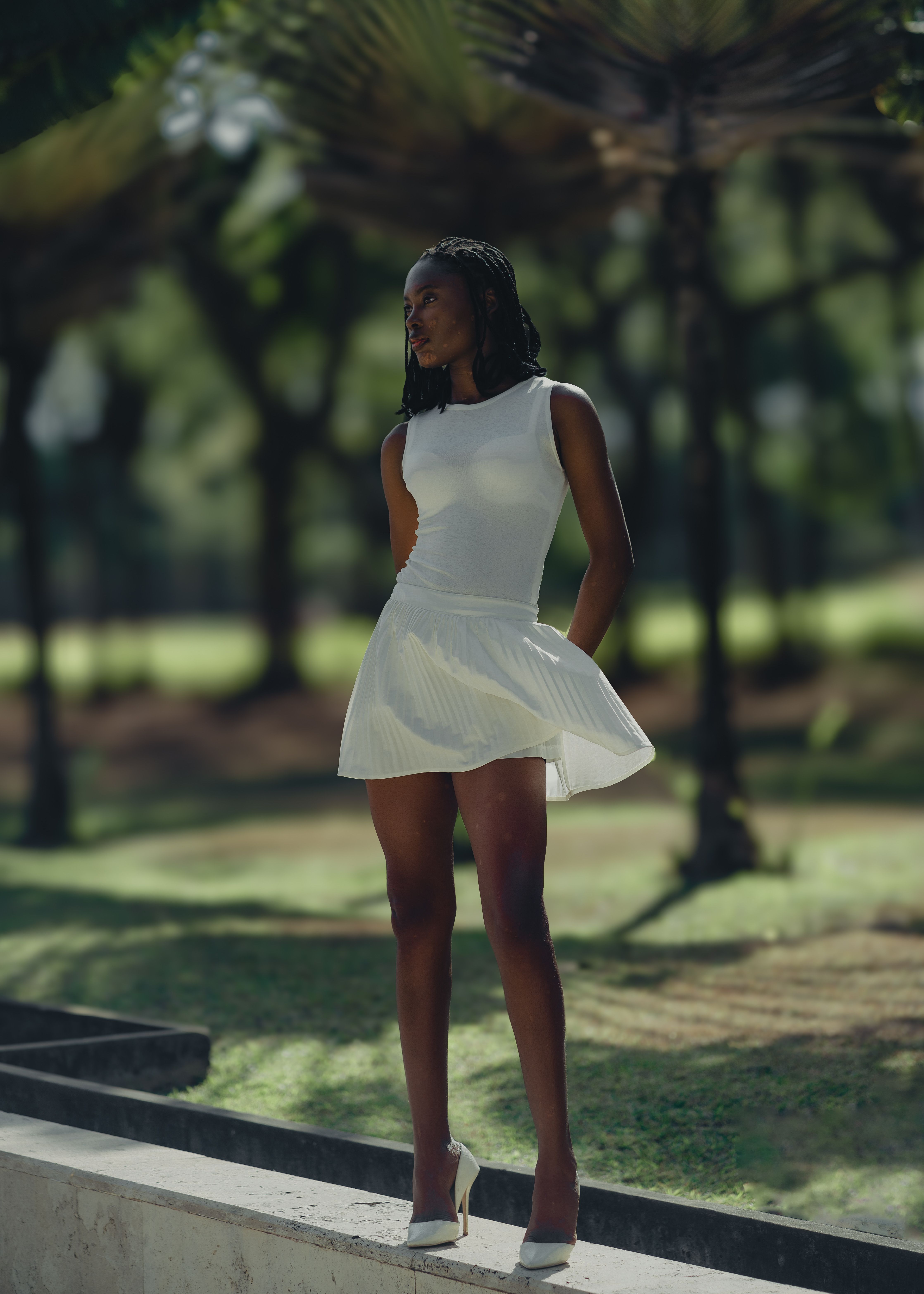 Stylish Woman in Park Wearing White Dress · Free Stock Photo