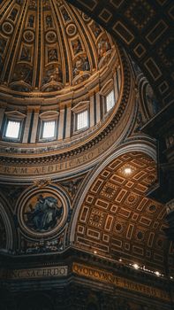 Stunning view of ornate dome ceiling in a historic cathedral highlighting architectural splendor.