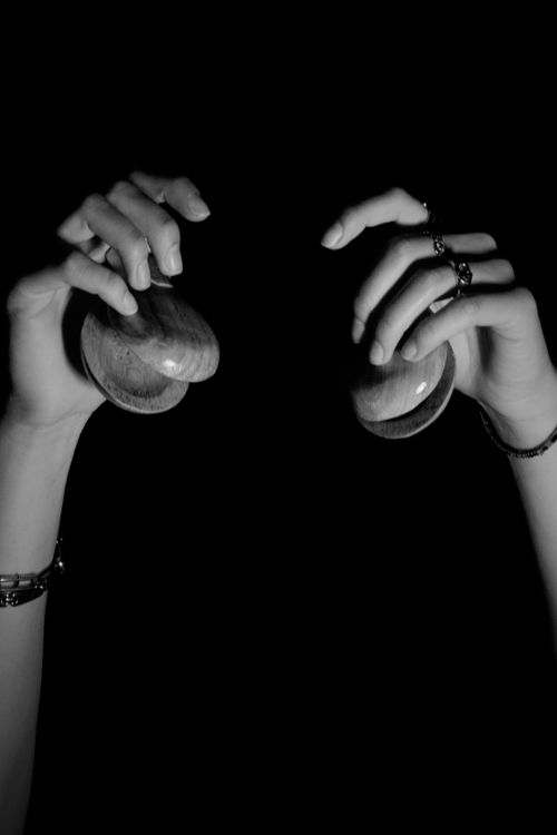 Free Stylish image of hands using castanets, evoking traditional Spanish dance. Stock Photo