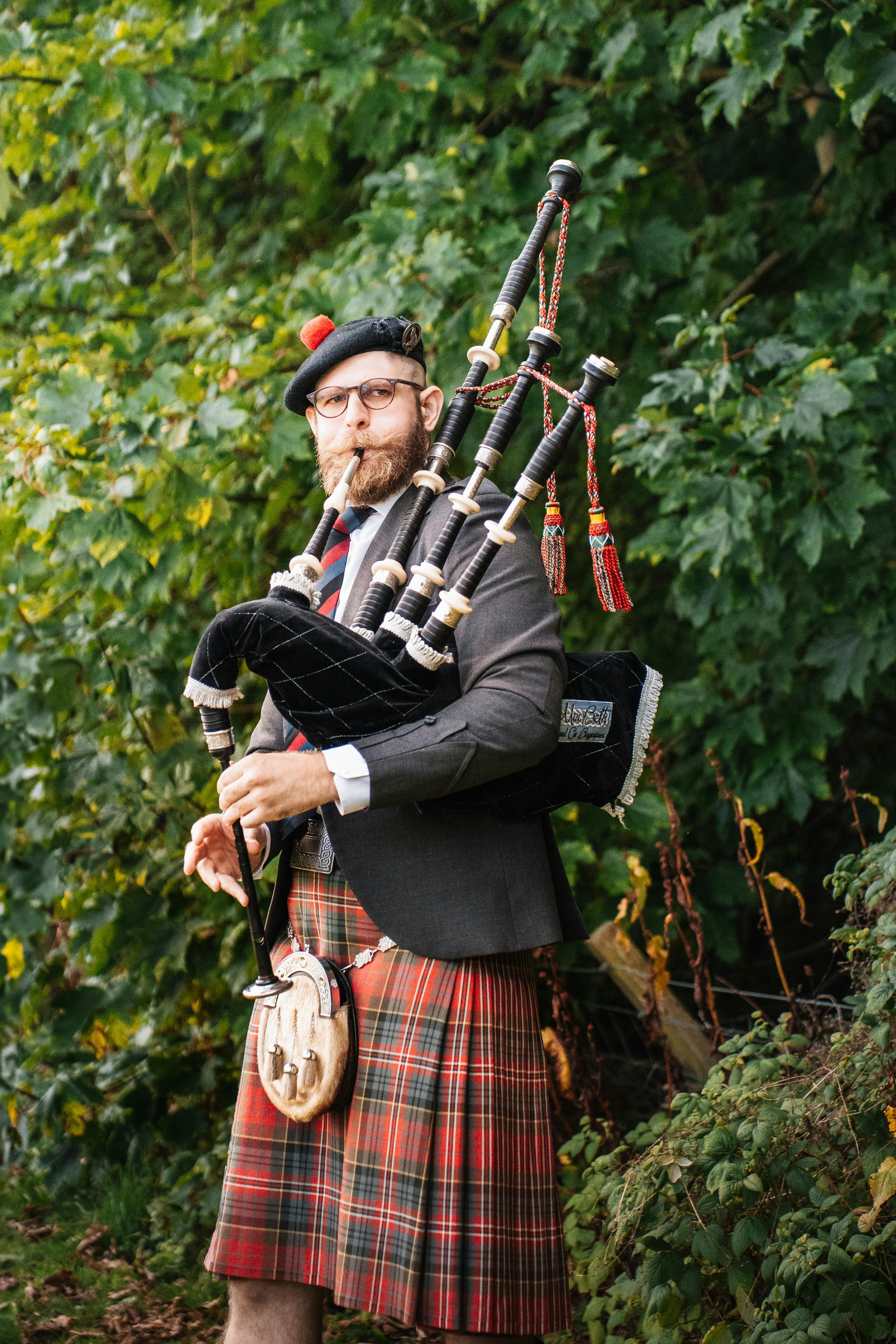 Scottish Bagpiper in Traditional Highland Attire · Free Stock Photo, image size:3792x5688