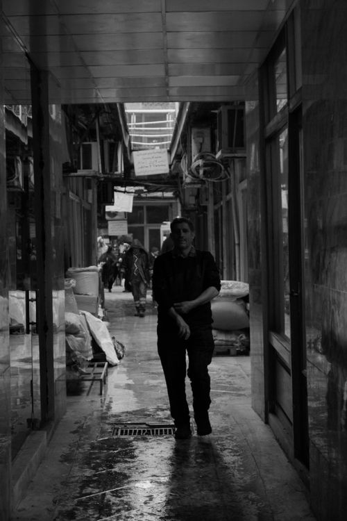 Free Black and white street scene in Tehran's traditional bazaar with moody ambiance. Stock Photo