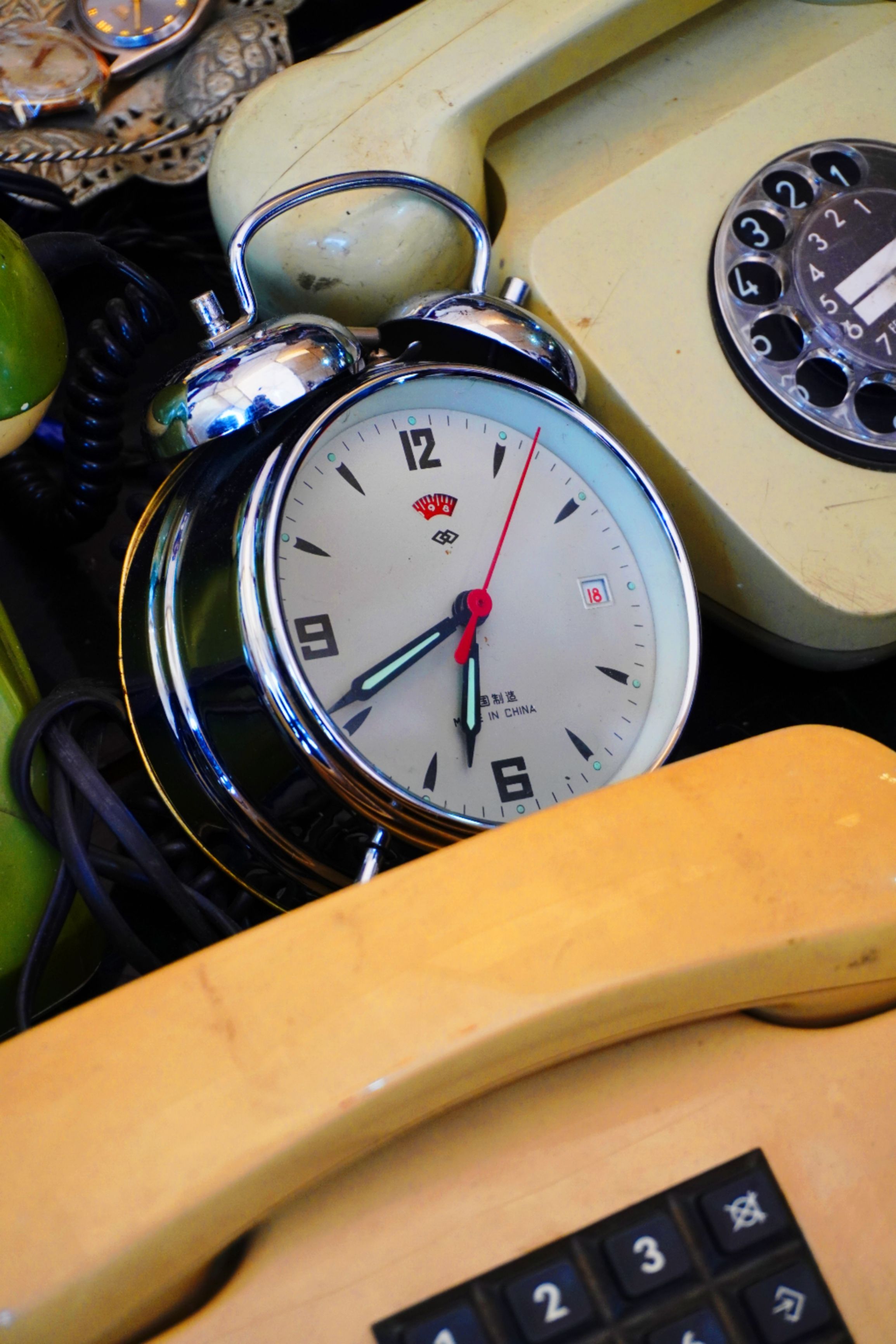 Vintage Alarm Clock with Retro Telephones · Free Stock Photo