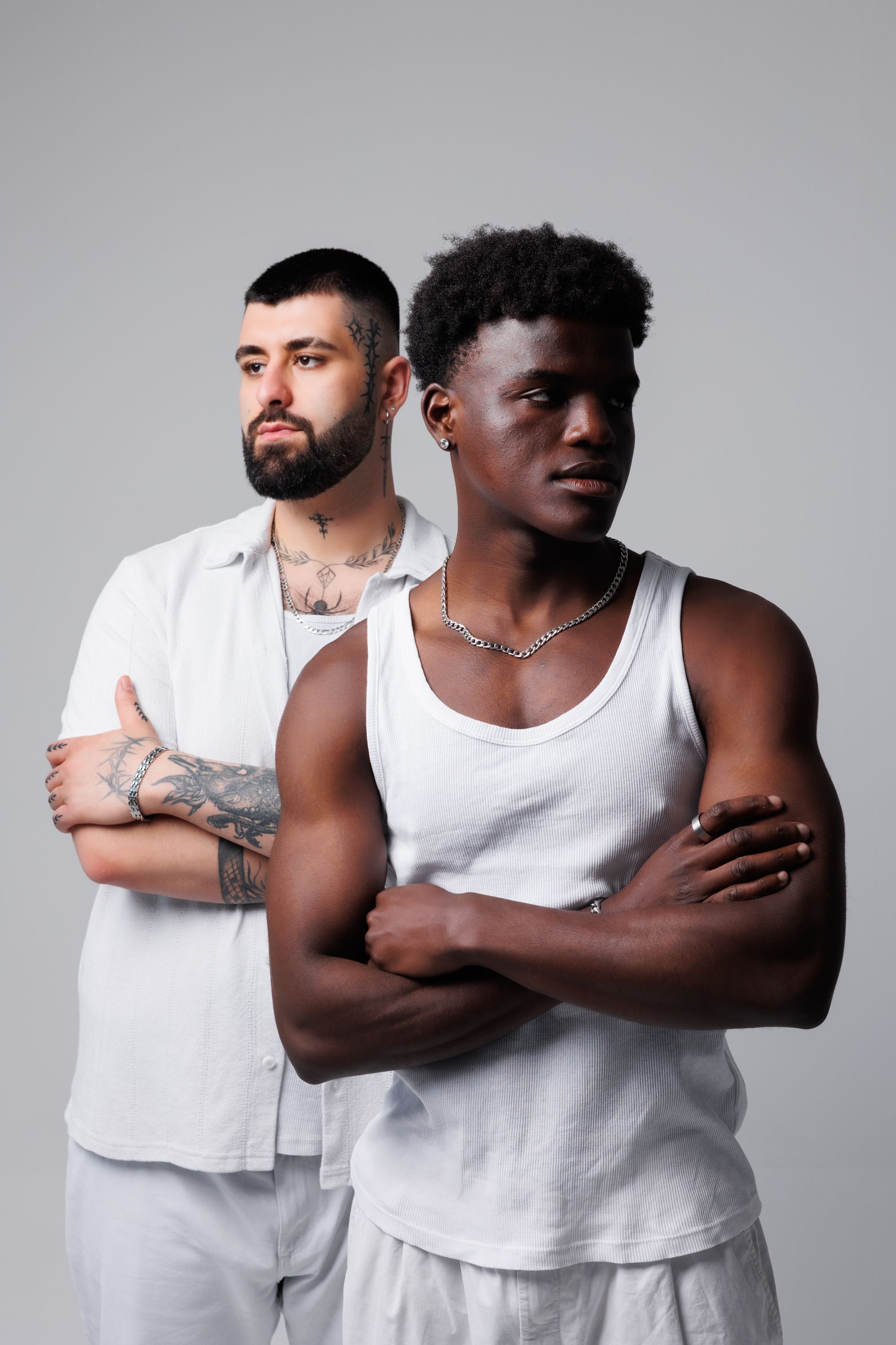 Portrait of Two Diverse Men in Studio Setting · Free Stock Photo
