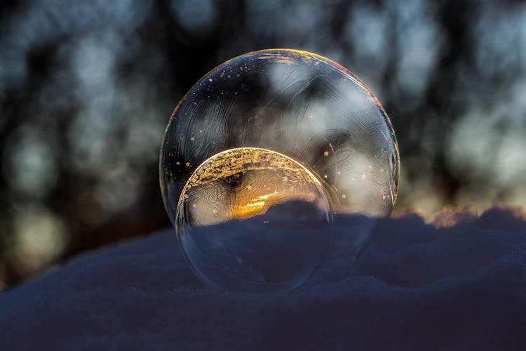 Close-up Of Crystal Ball Against Blurred Background