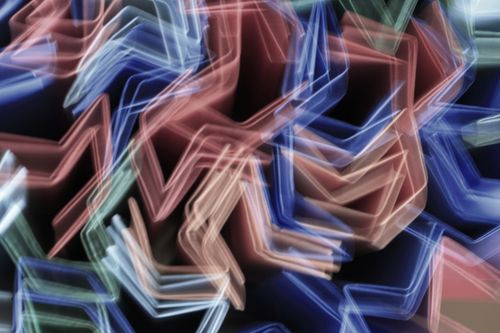 Free Vibrant abstract light trails forming zigzag patterns, capturing dynamic movement. Stock Photo