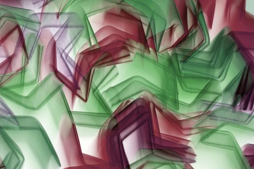 Vibrant red and green abstract shapes creating dynamic geometric patterns.