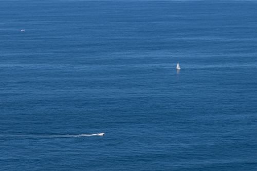 Free A tranquil sailboat journey on the expansive blue waters of the Basque Coast, Spain. Stock Photo