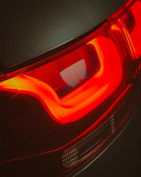 Detailed view of a sleek red LED tail light on a modern vehicle.