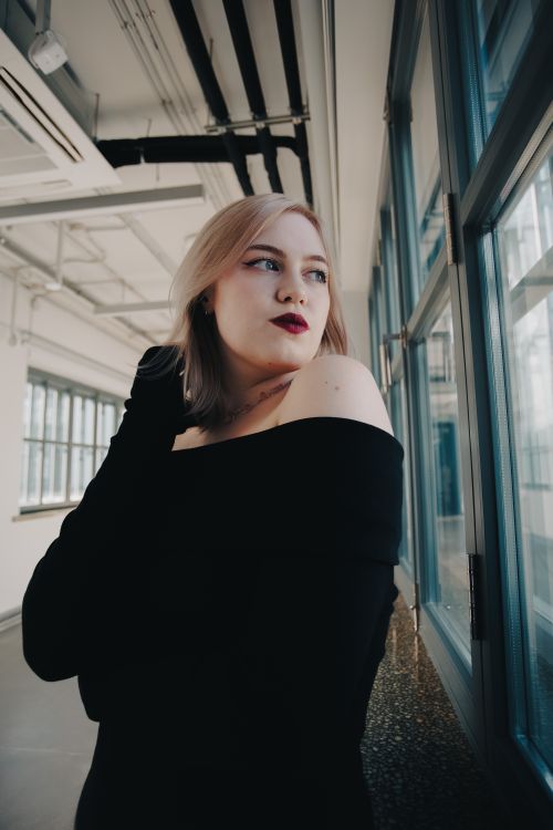 Stylish Woman Posing in Modern Interior · Free Stock Photo