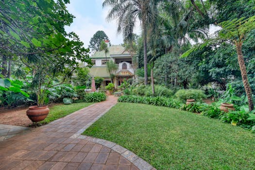 Beautiful house with a vibrant garden pathway in Pretoria, South Africa.