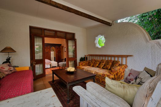 Cozy indoor patio with vintage furniture and a warm atmosphere.